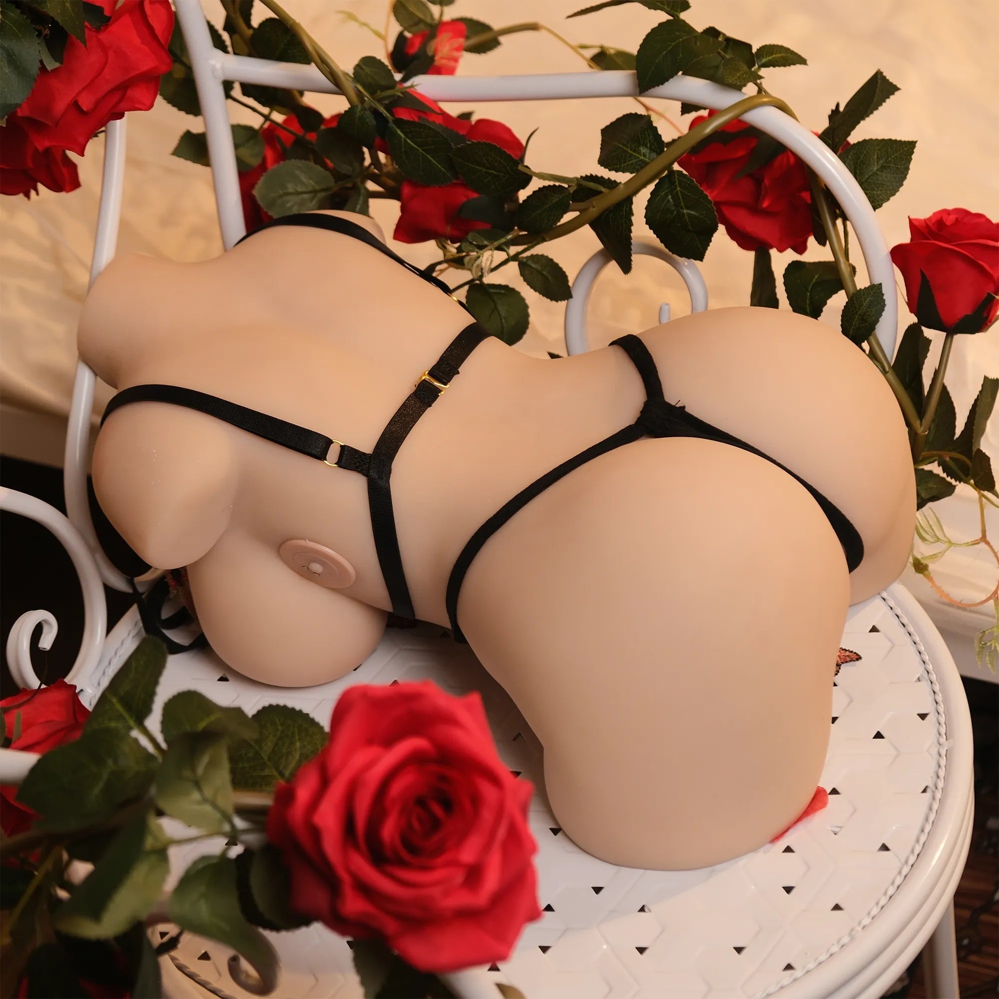 Evolova pregnant sex doll in green lingerie posing gracefully beside a vase, showcasing realistic pregnancy beauty.