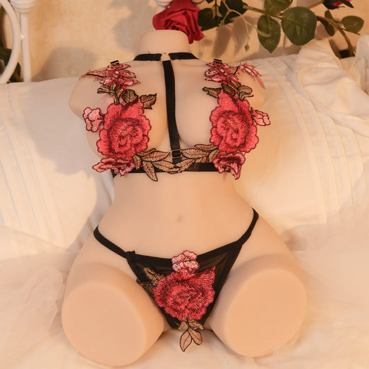 Evolova robotic sex doll in black and red lingerie sitting beside a teacup, blending sensuality with futuristic design.