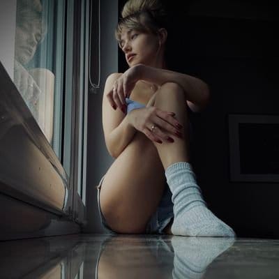 Flirty couple communicating comfortably while discussing sexy questions with trust and playful energy